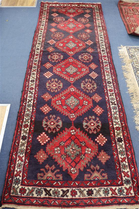 A red and blue ground Persian runner, 290cm x 90cm